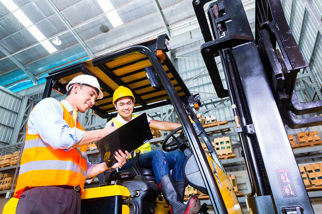 Forklift instructor teaching a student