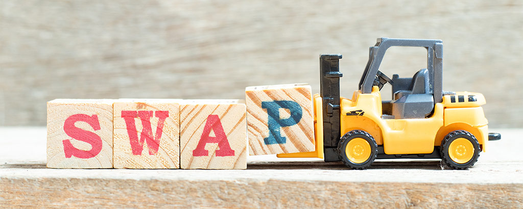 Forklift displaying the word swap on blocks